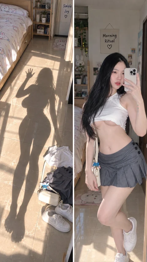 A split composition pairs a long shadow on a sunlit floor with a woman taking a mirror portrait in a cropped top and gray skirt.